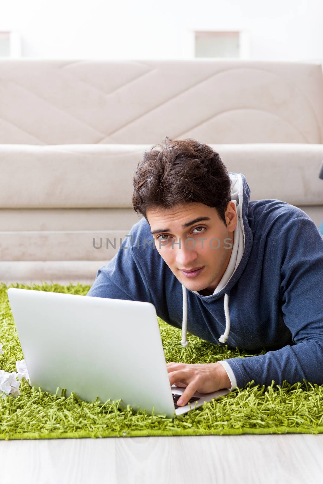 Handsome student working at startup project at home 