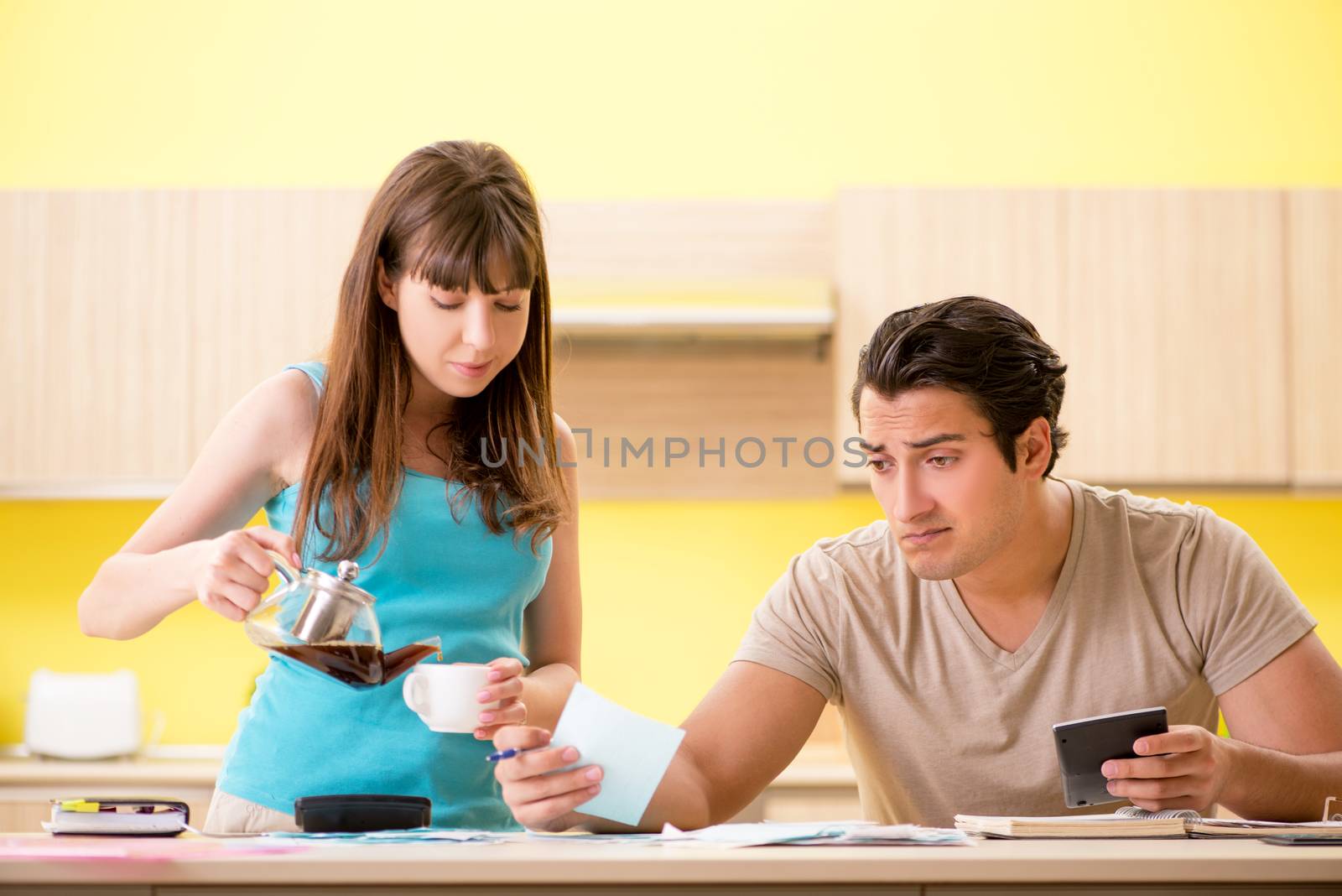 Young family struggling with personal finance by Elnur