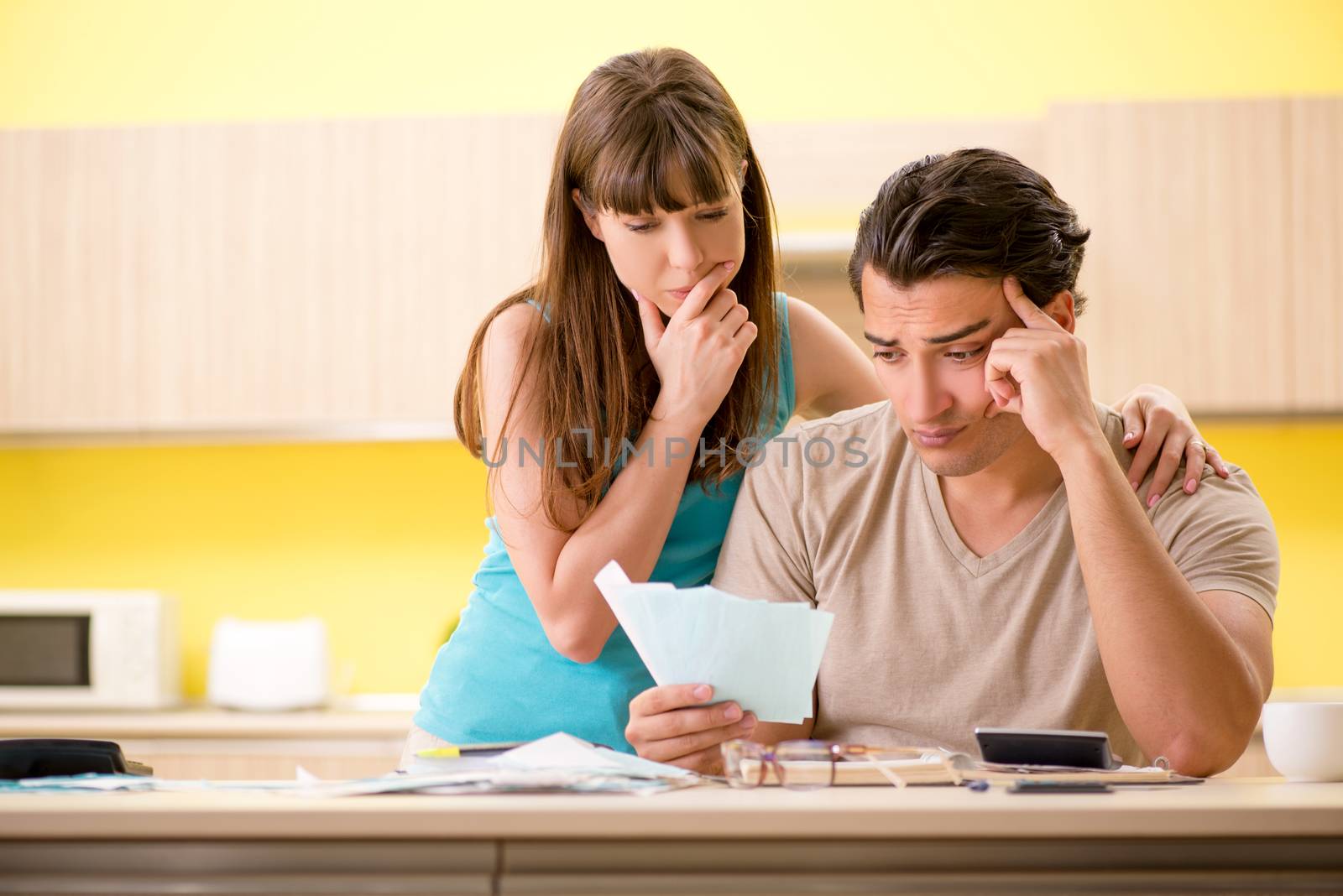 Young family struggling with personal finance by Elnur