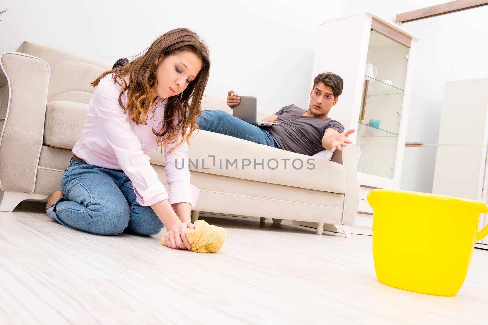 House floor cleaning concept with wife and husband