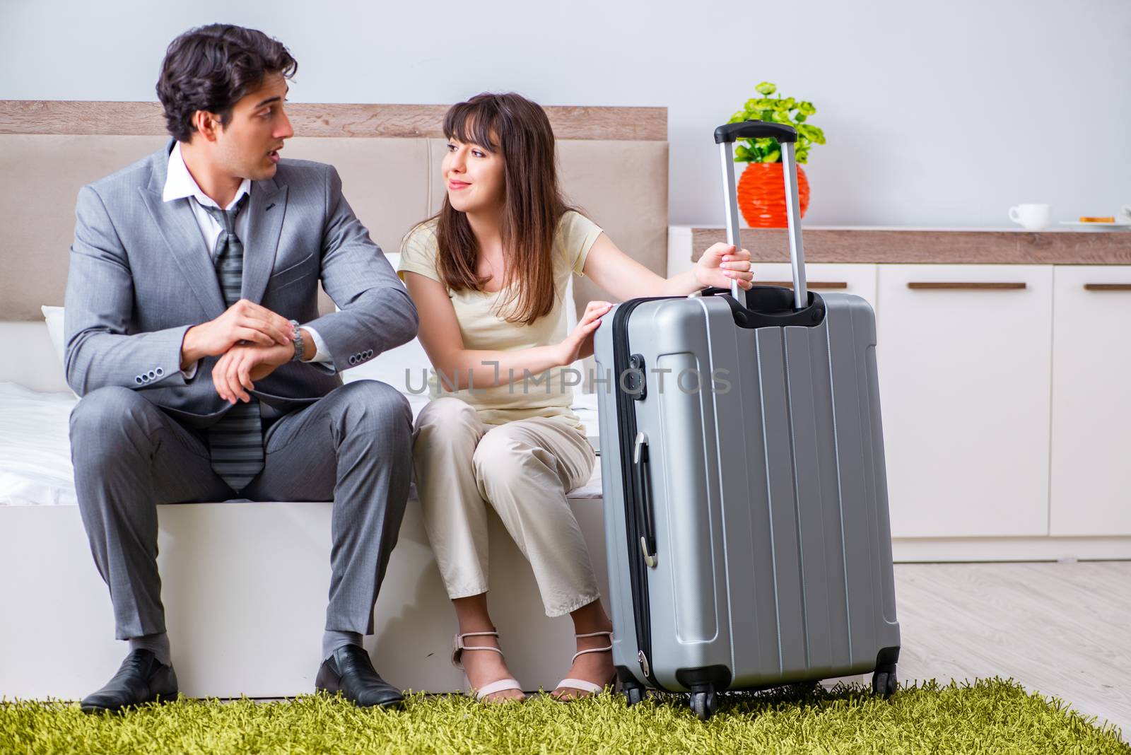 Wife seeing her husband off to business trip