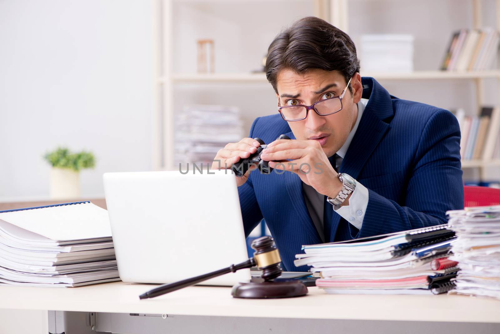 Young handsome judge working in court