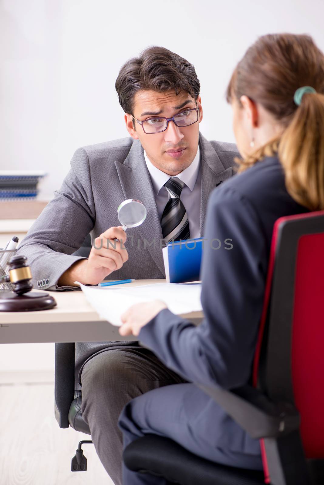 Lawyer talking to client in office