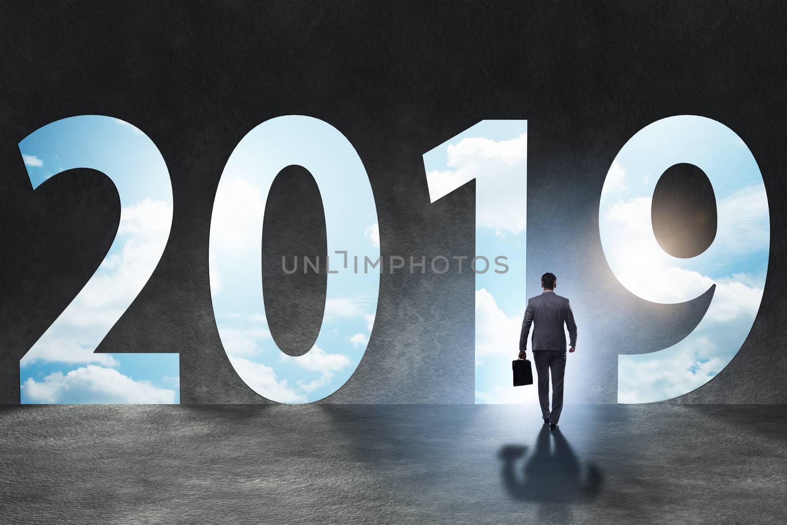 Businessman in the concept of transition to year 2019