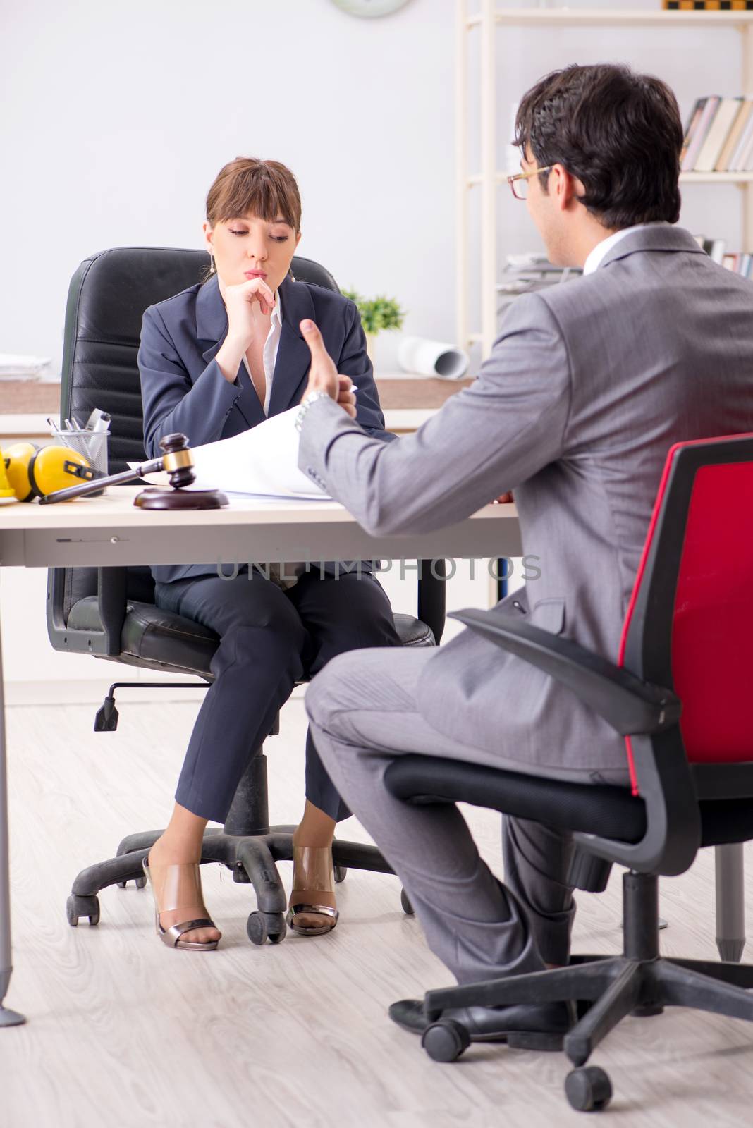 Man and woman discussing construction project