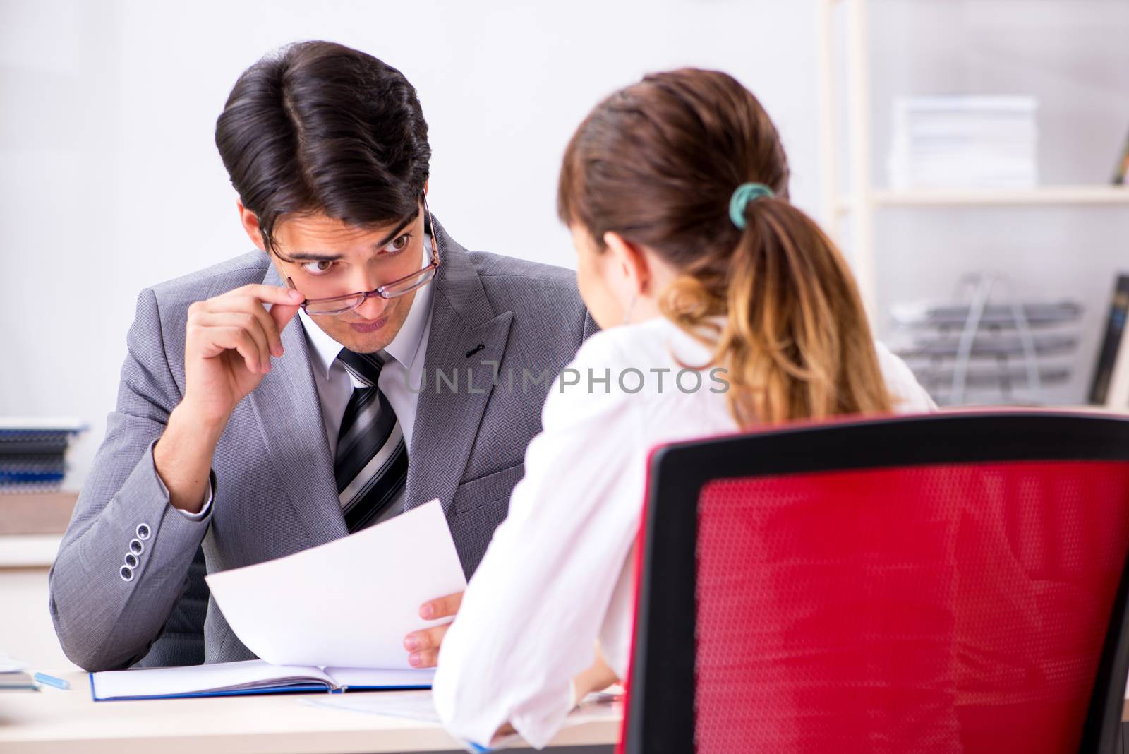 Man and woman discussing in office
