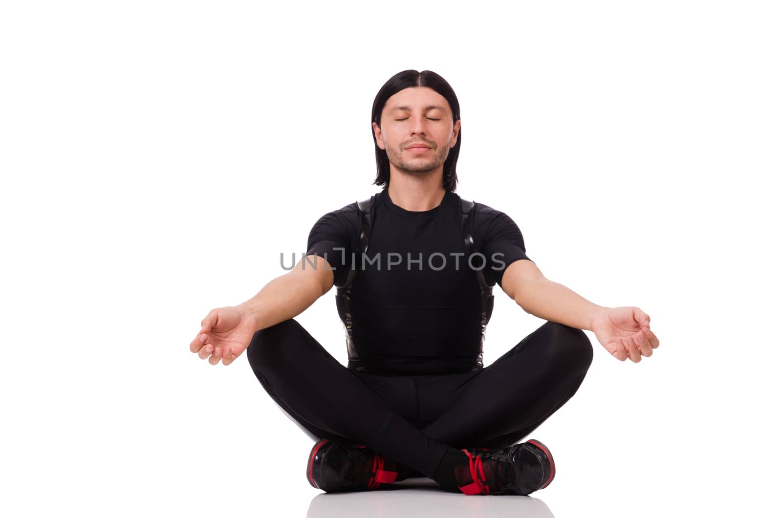 Young man doing exercises isolated on white by Elnur