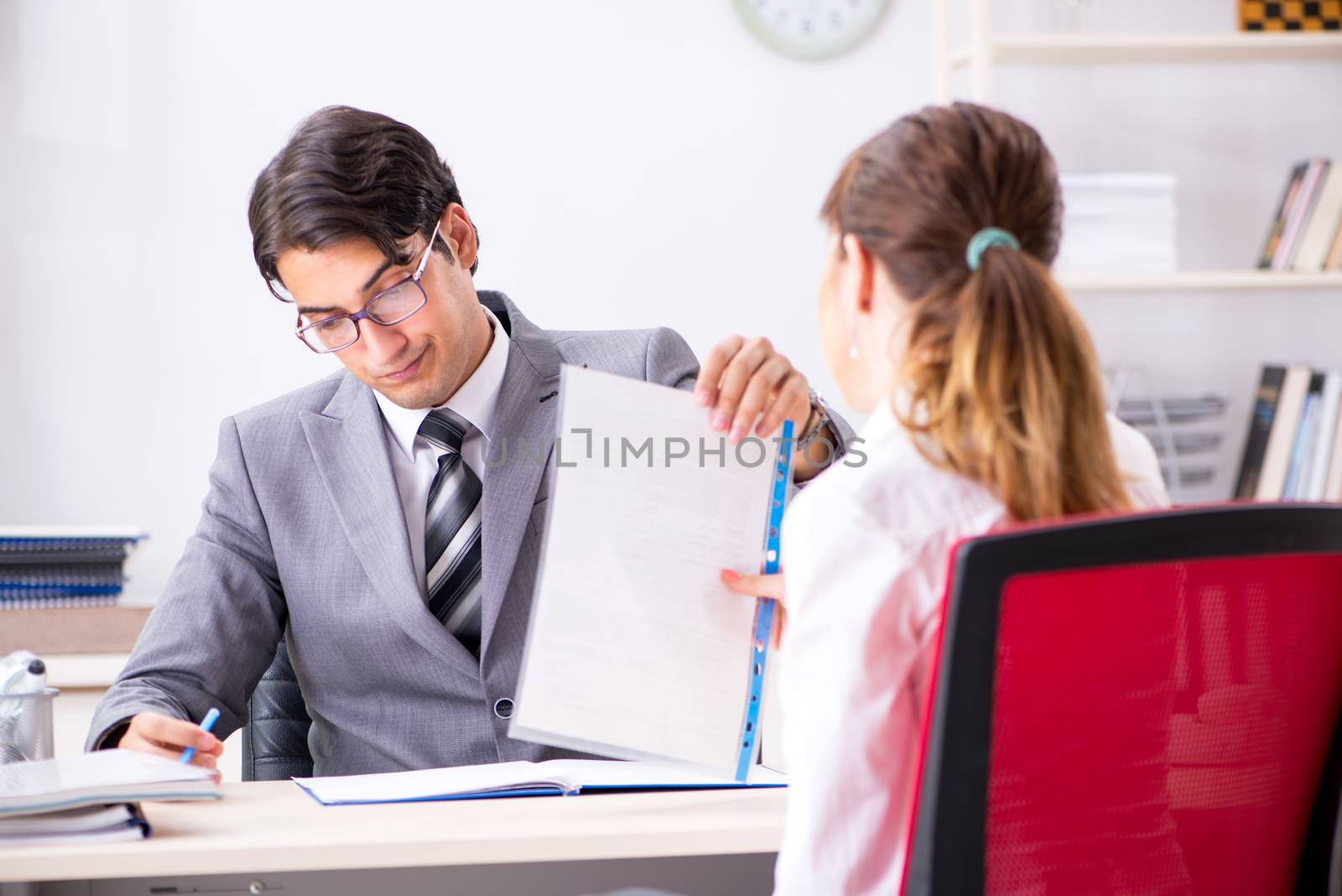 Man and woman discussing in office