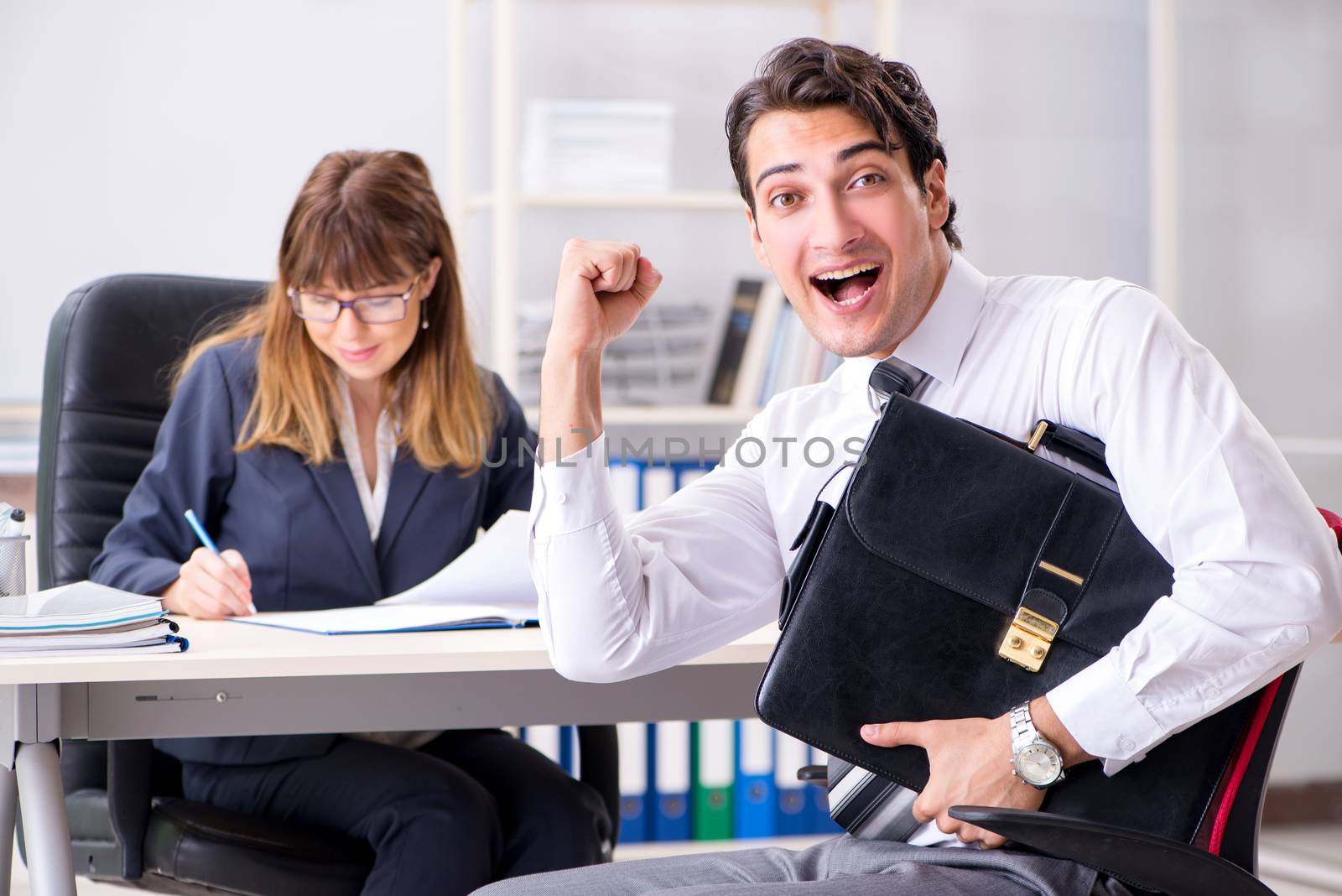 Man and woman discussing in office