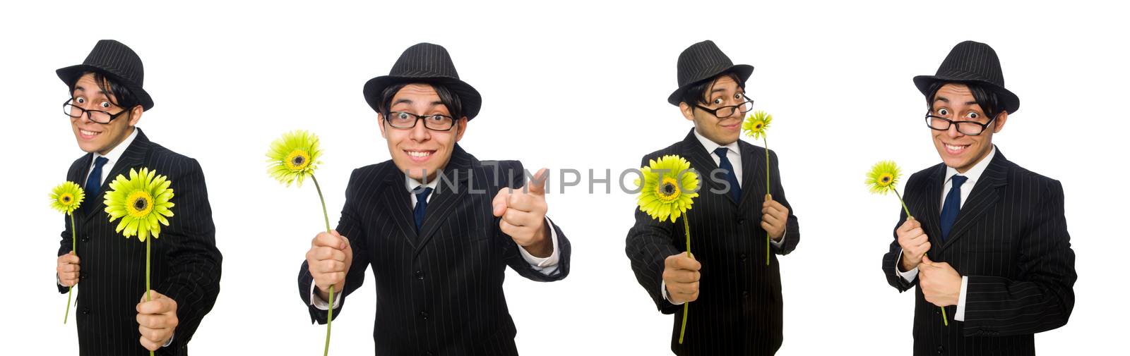 Young man in black costume with flower isolated on white