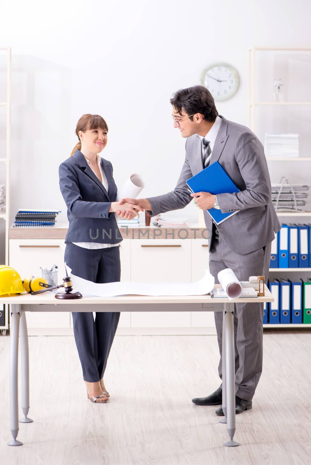 Man and woman discussing construction project