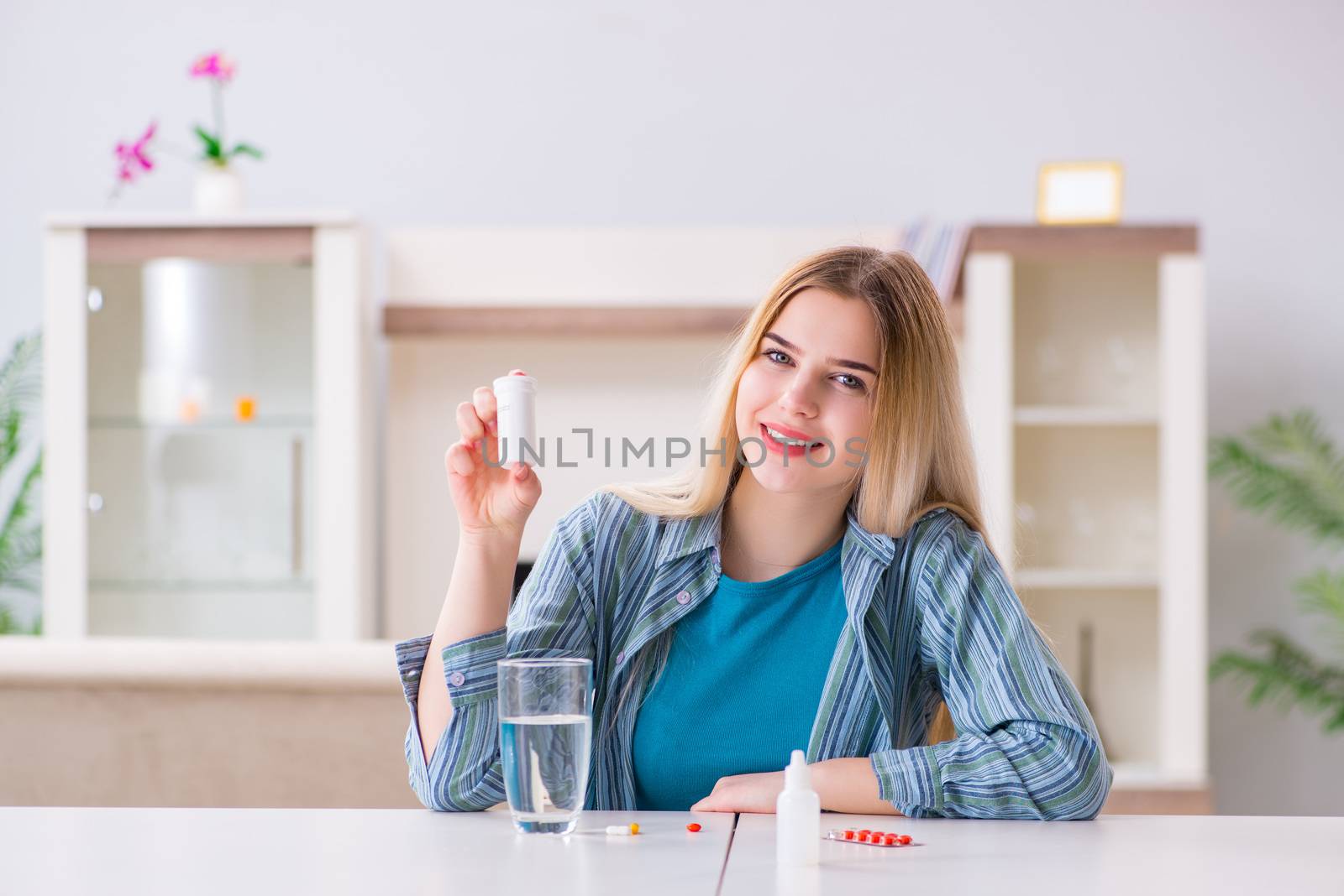 Woman taking pills to cope with pain