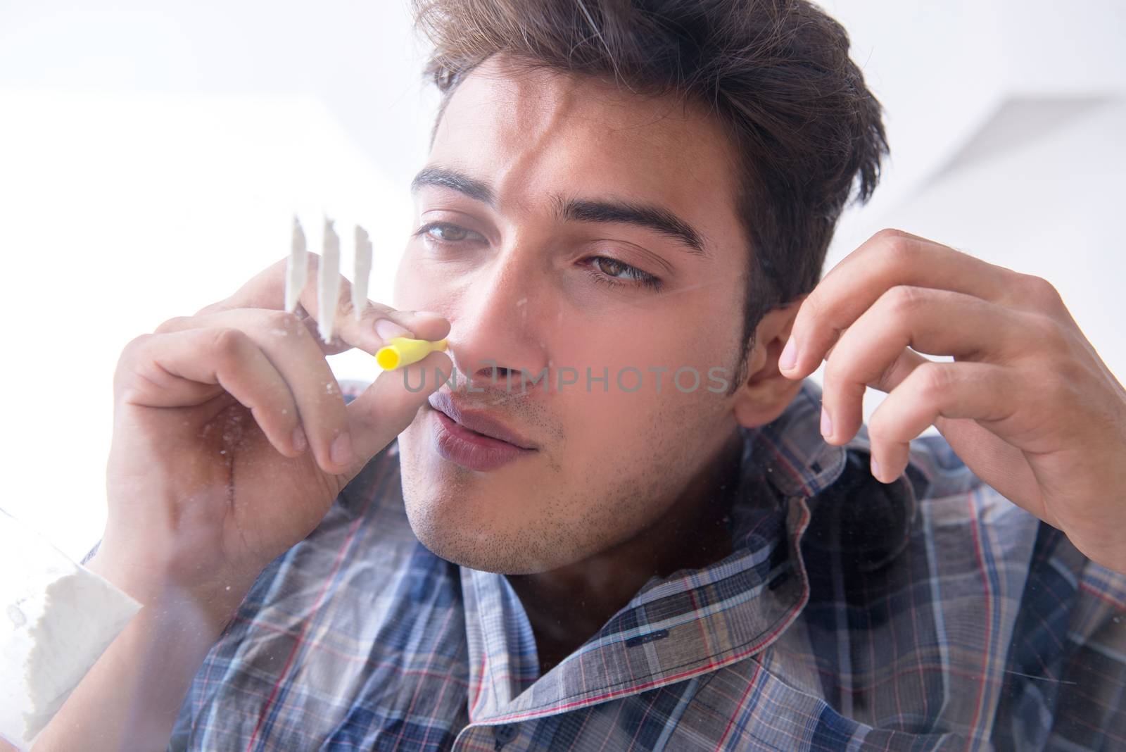 Drug addict sniffing cocaine narcotic