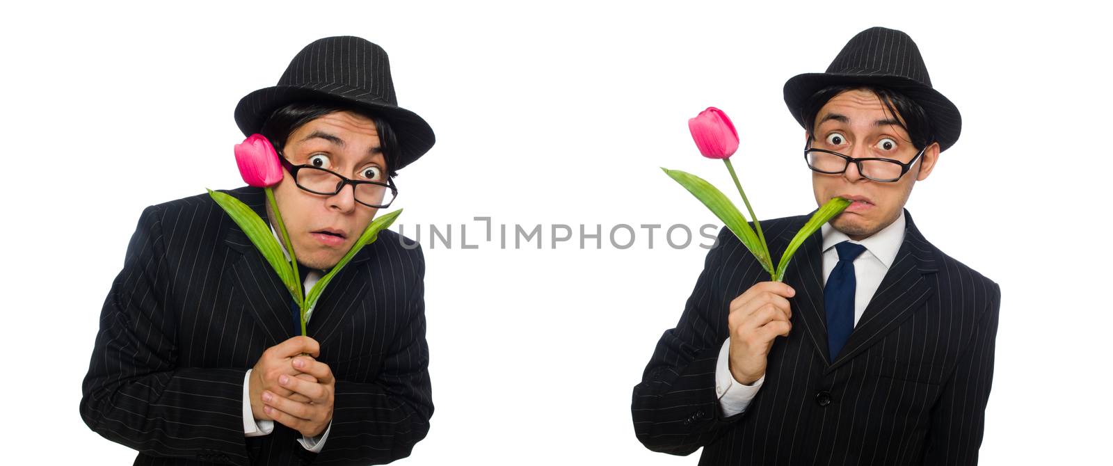 Young man in black costume with flower isolated on white