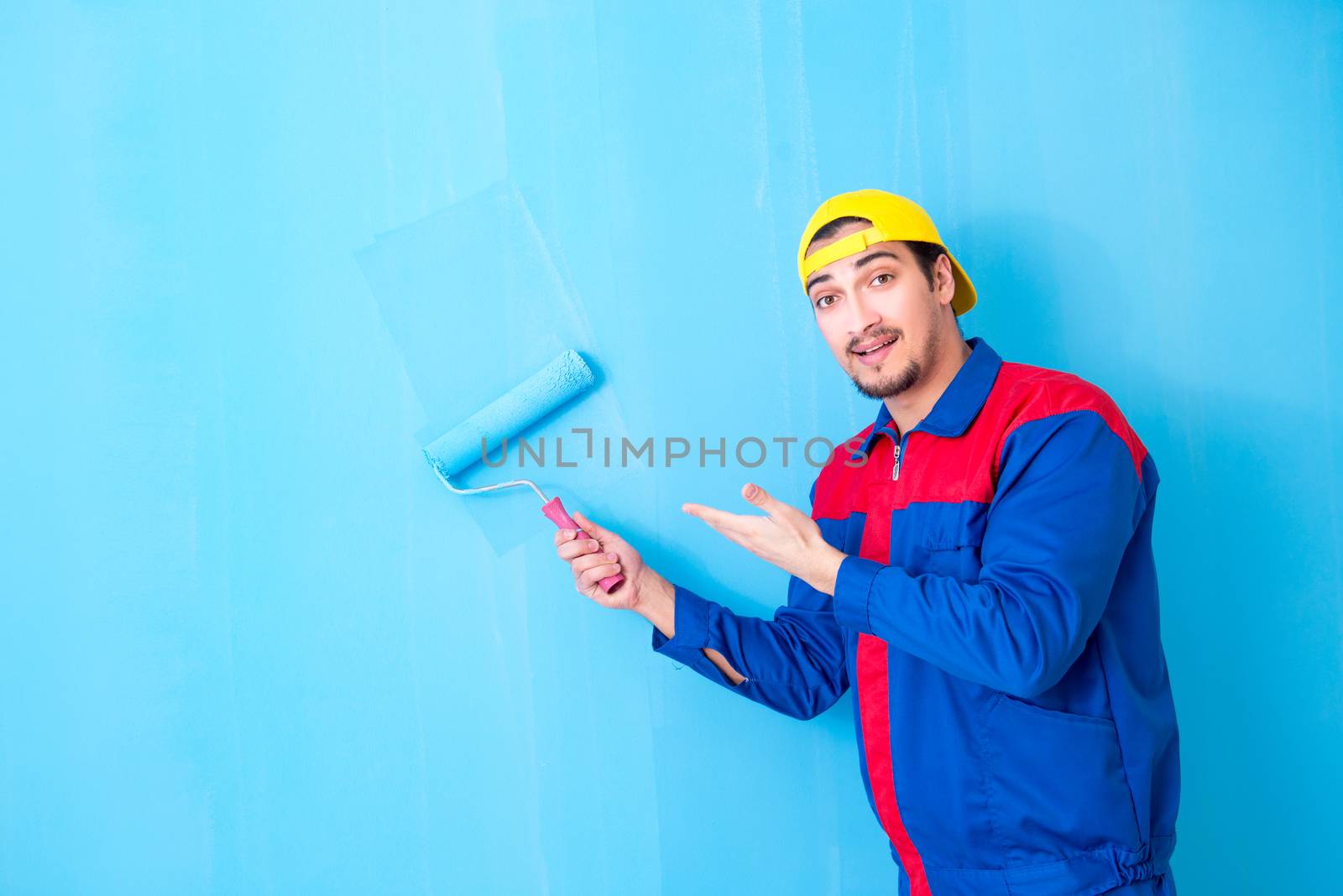 Young painter doing renovation at home 