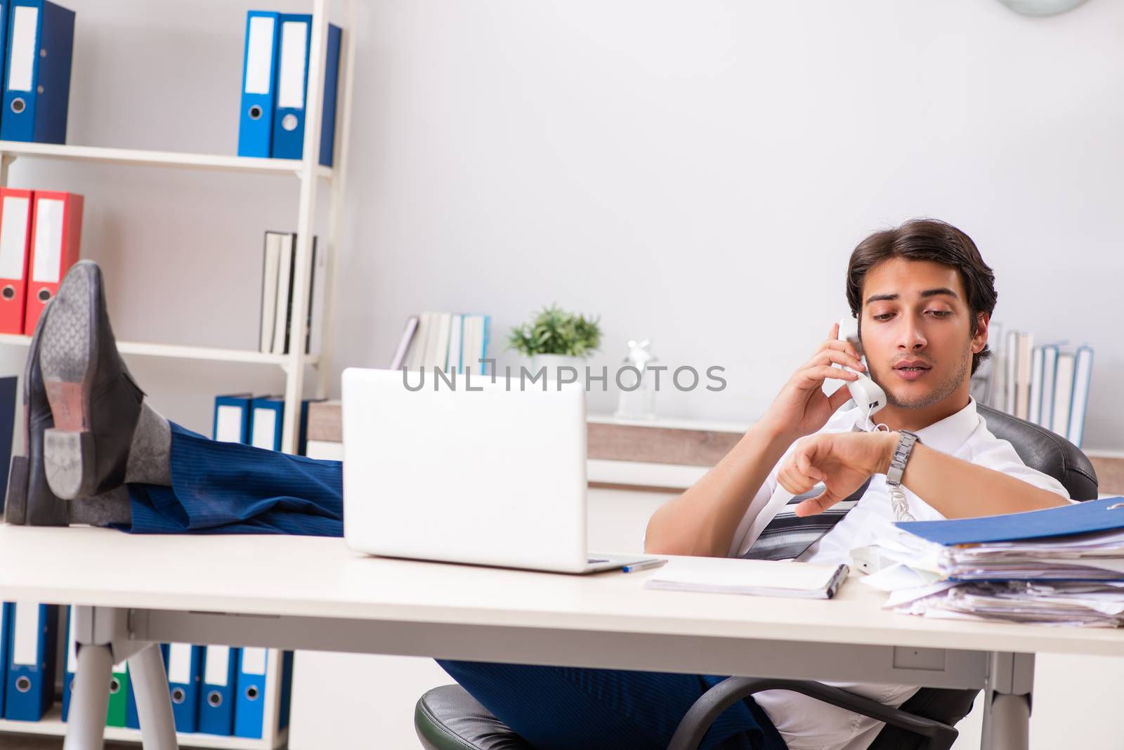 Young call center operator speaking on phone