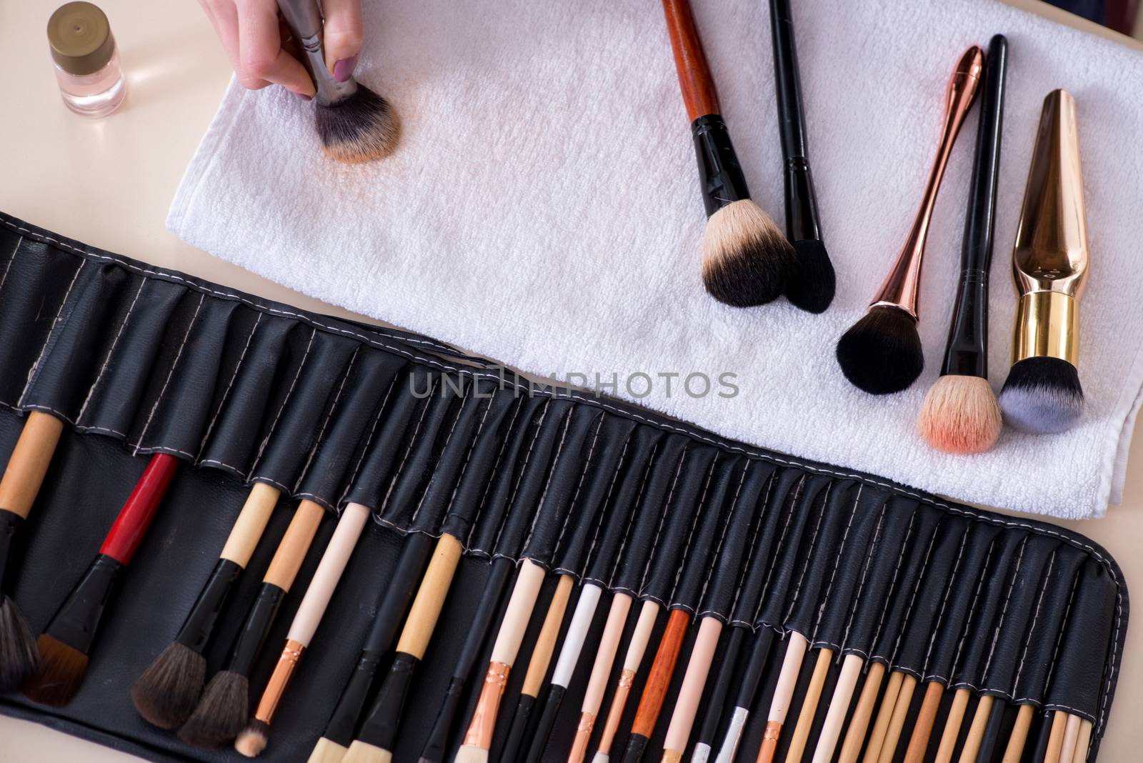 Make-up artist preparing brushes for work