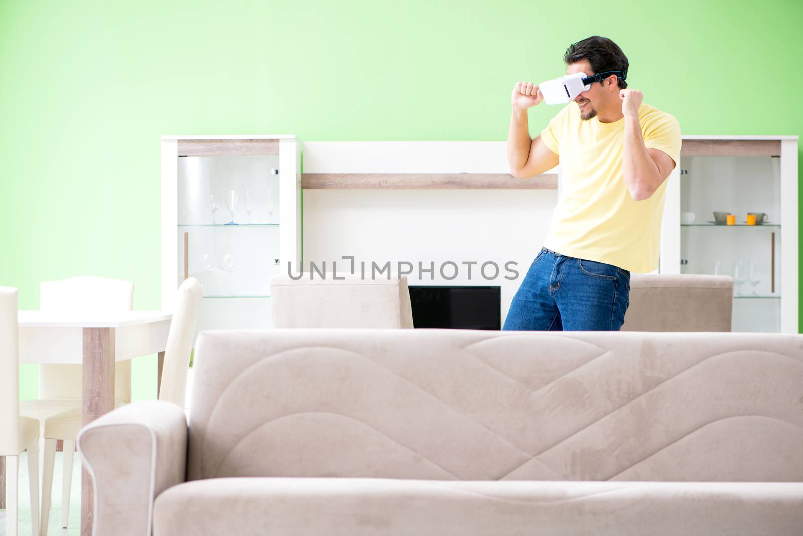 Young man with virtual reality goggles