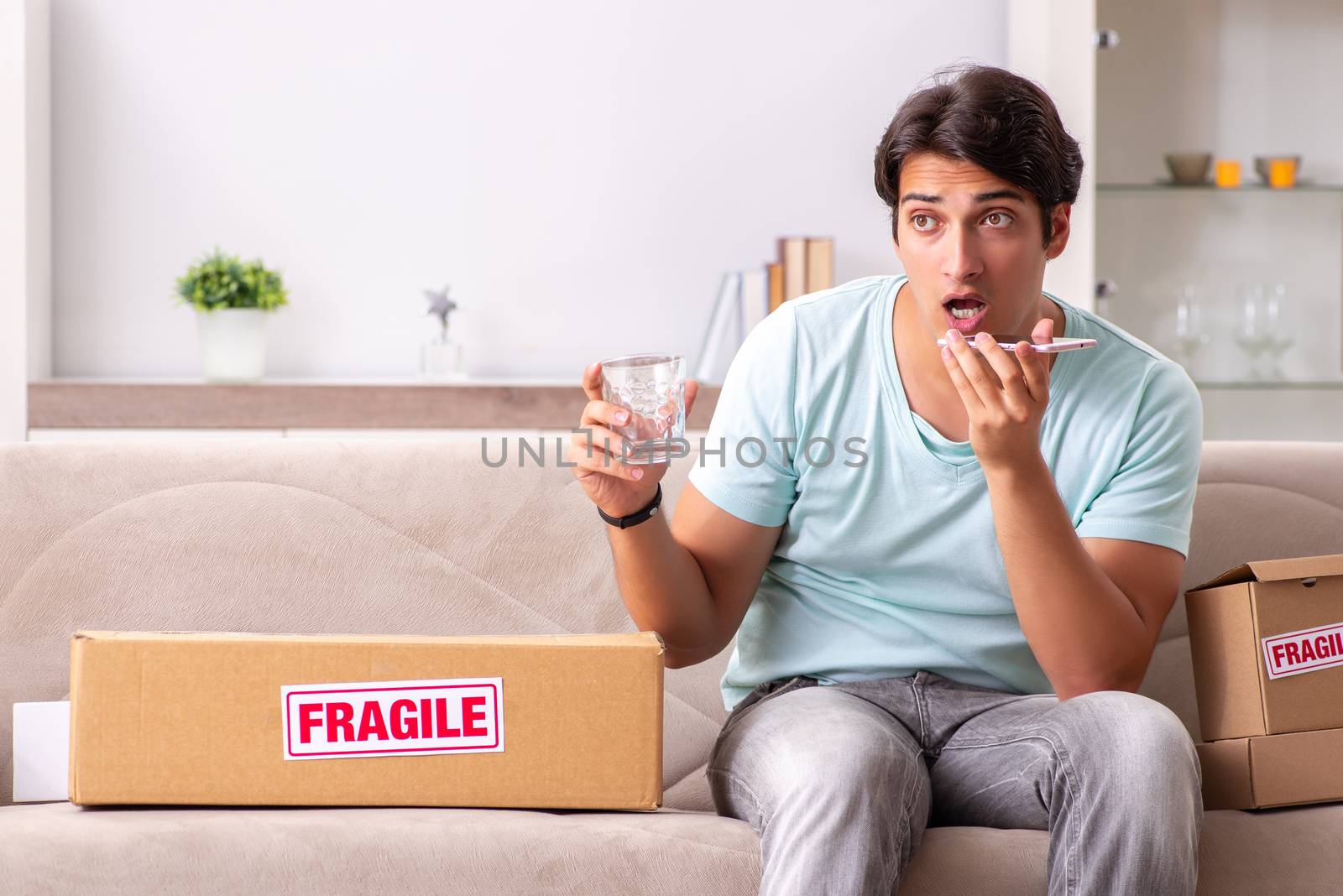 Man opening fragile parcel ordered from internet