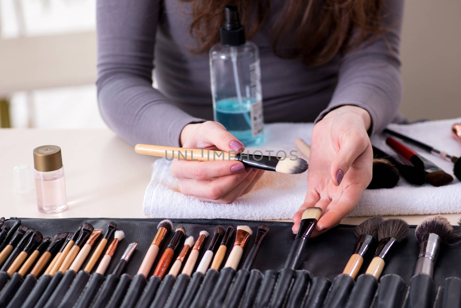 Make-up artist preparing brushes for work