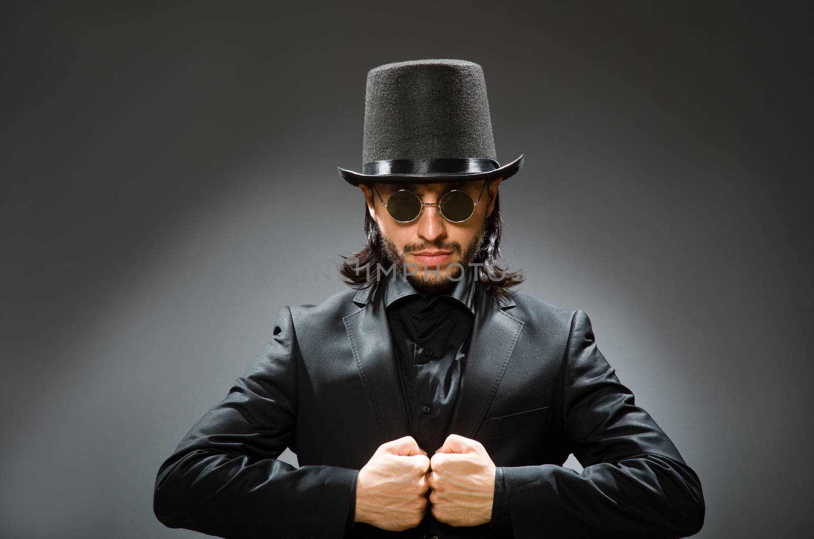 Vintage concept with man wearing black top hat