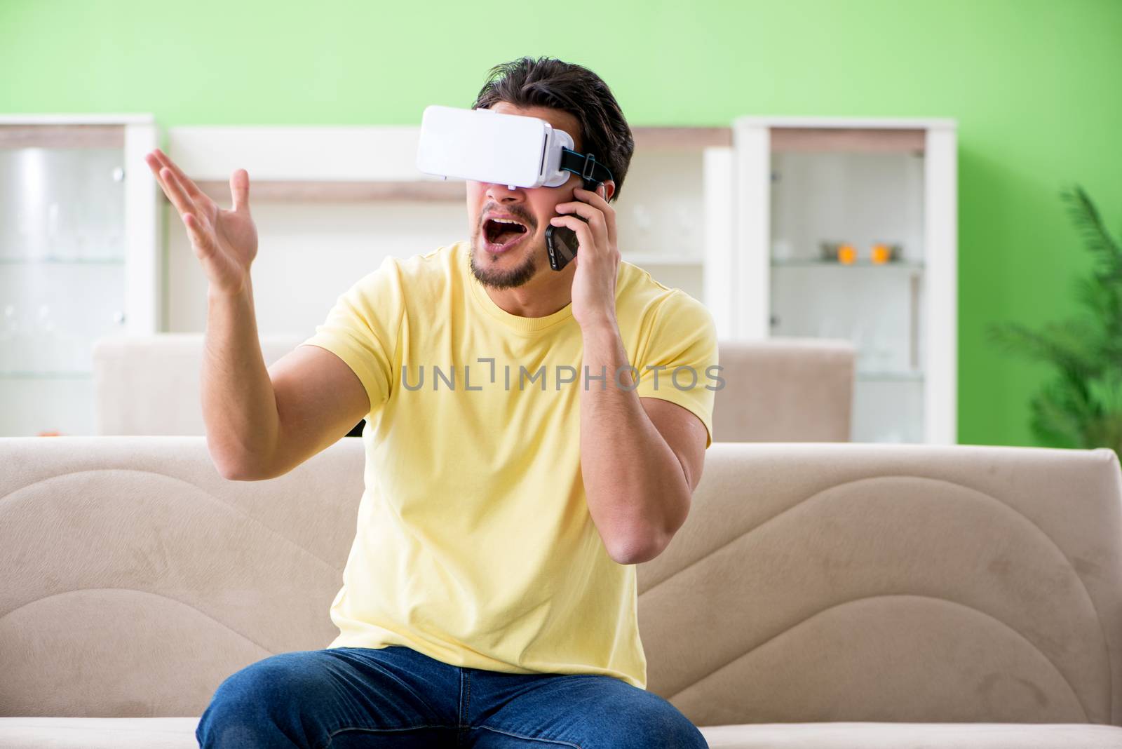 Young man with virtual reality goggles