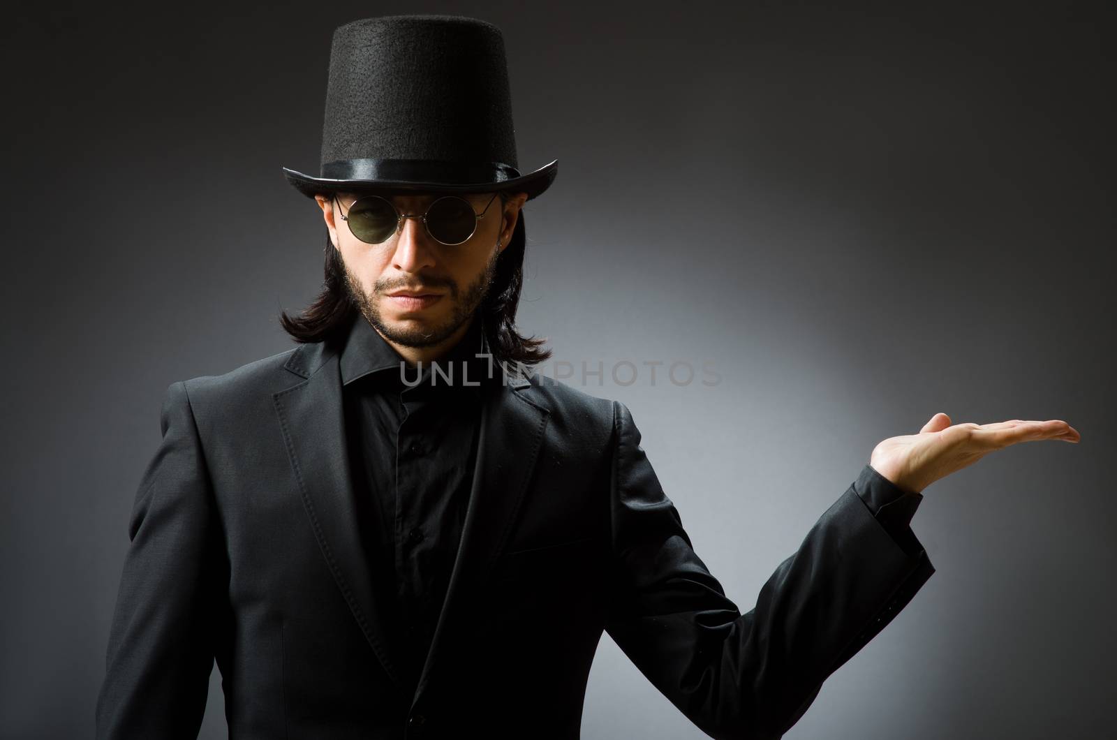 Vintage concept with man wearing black top hat