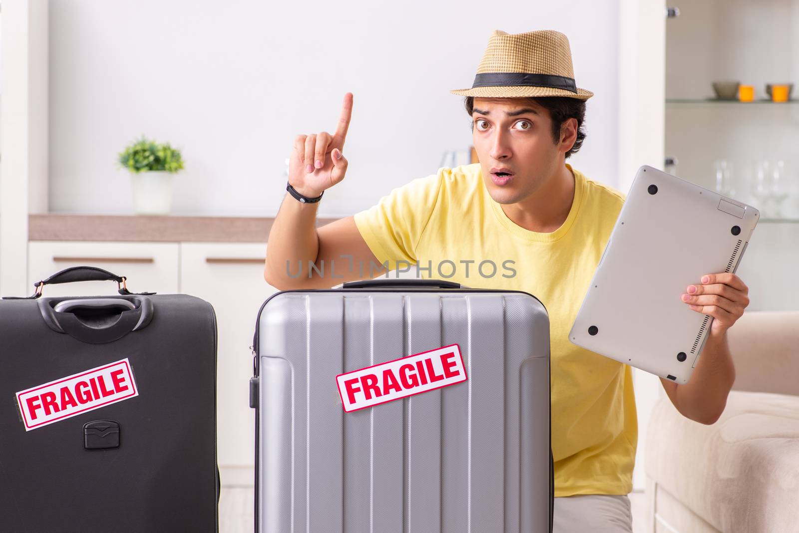Man going on vacation with fragile suitcases