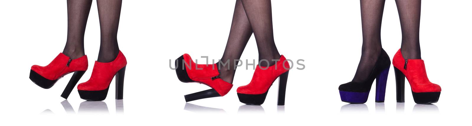 Woman legs with red shoes isolated on the white by Elnur