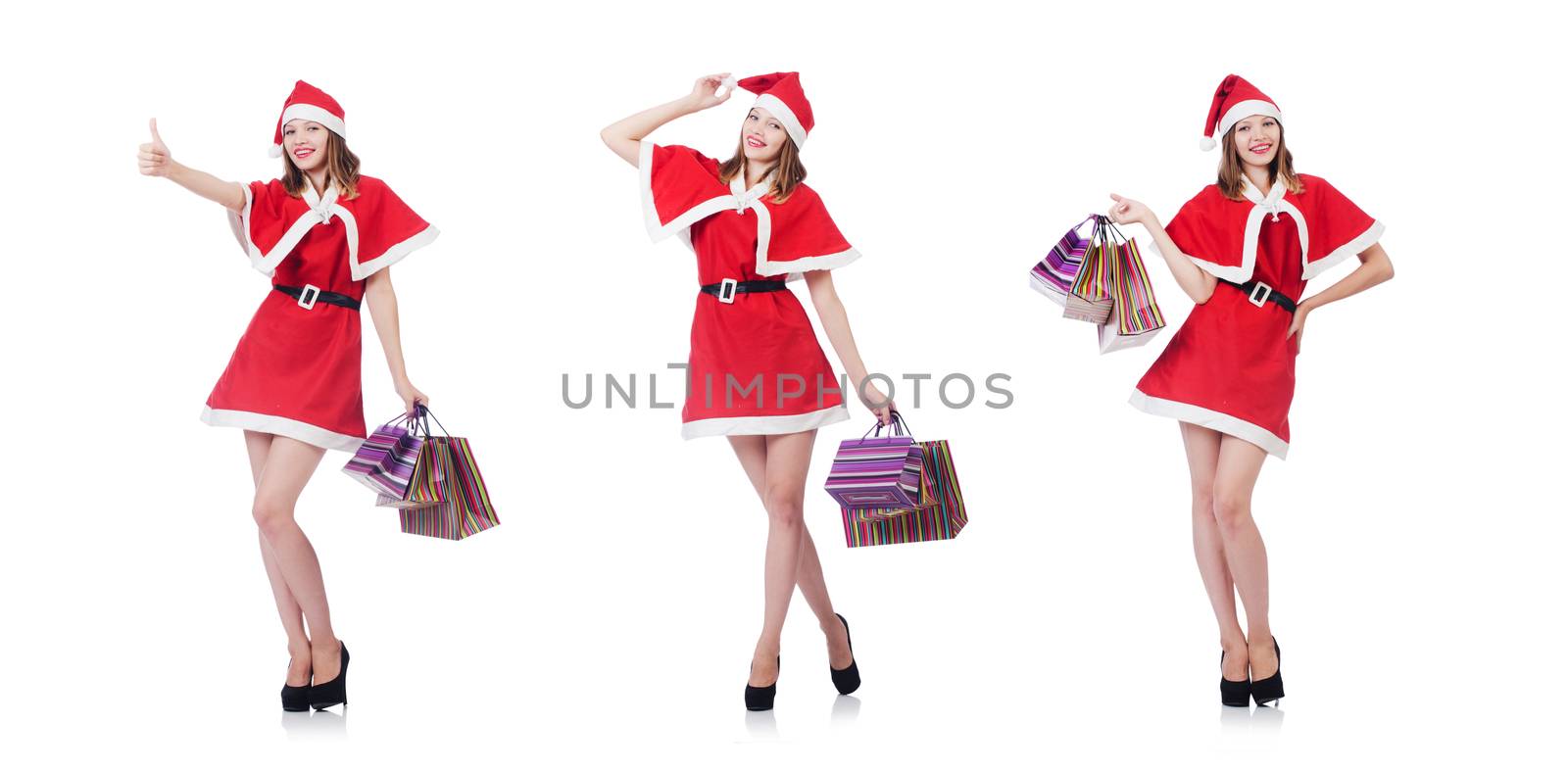 Young woman in red santa costume on white
