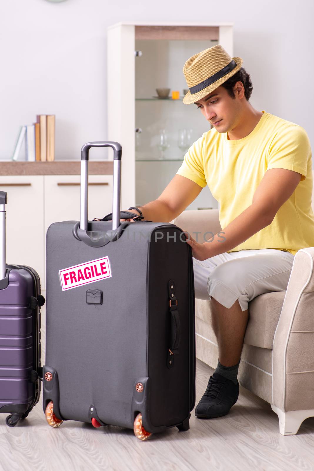 Man going on vacation with fragile suitcases