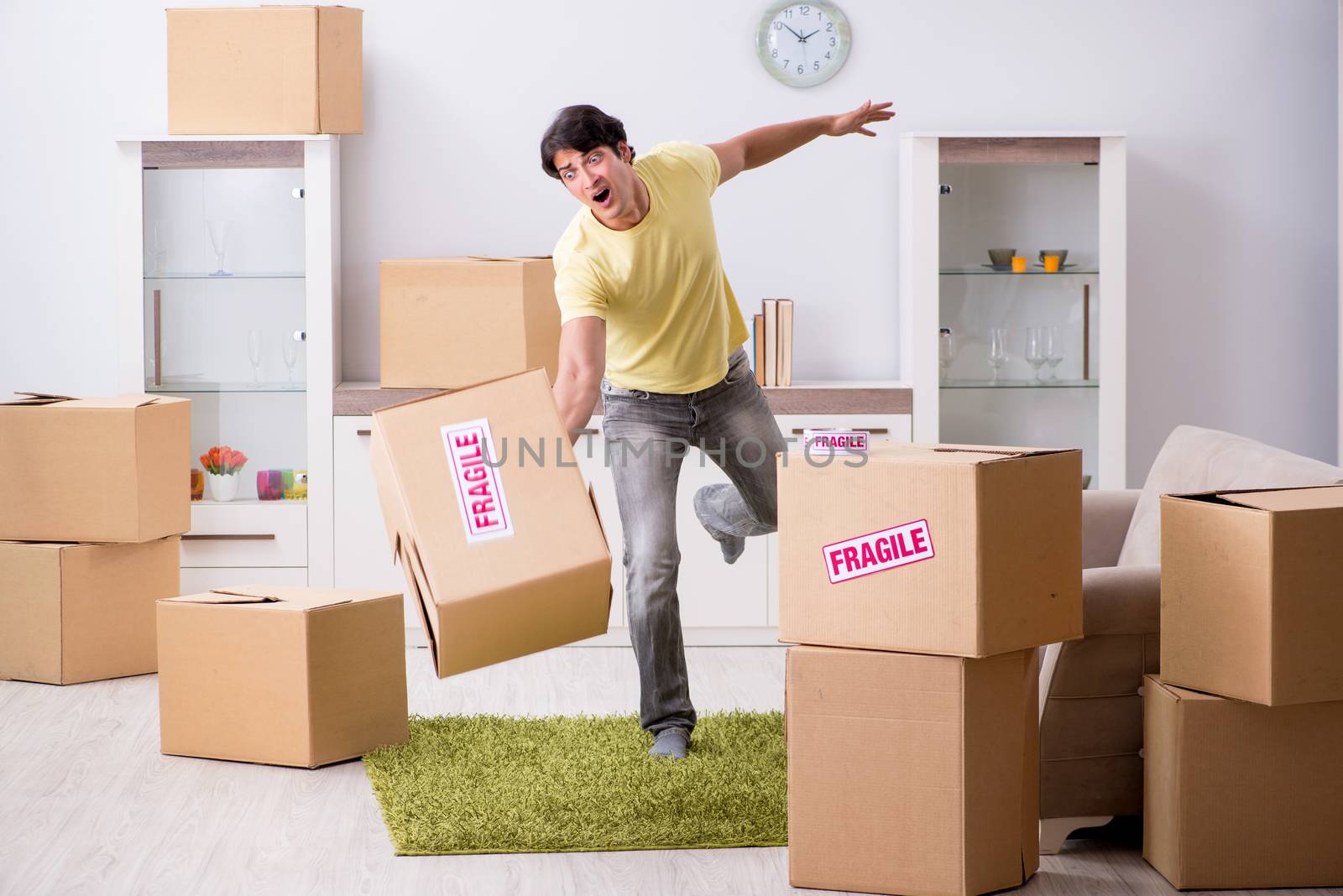 Man moving house and relocating with fragile items