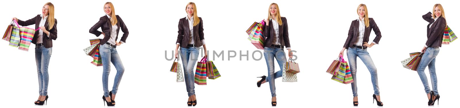 Beautiful woman with shopping bags isolated on white by Elnur