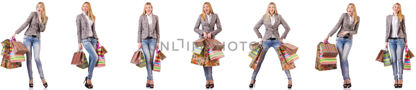 Beautiful woman with shopping bags isolated on white