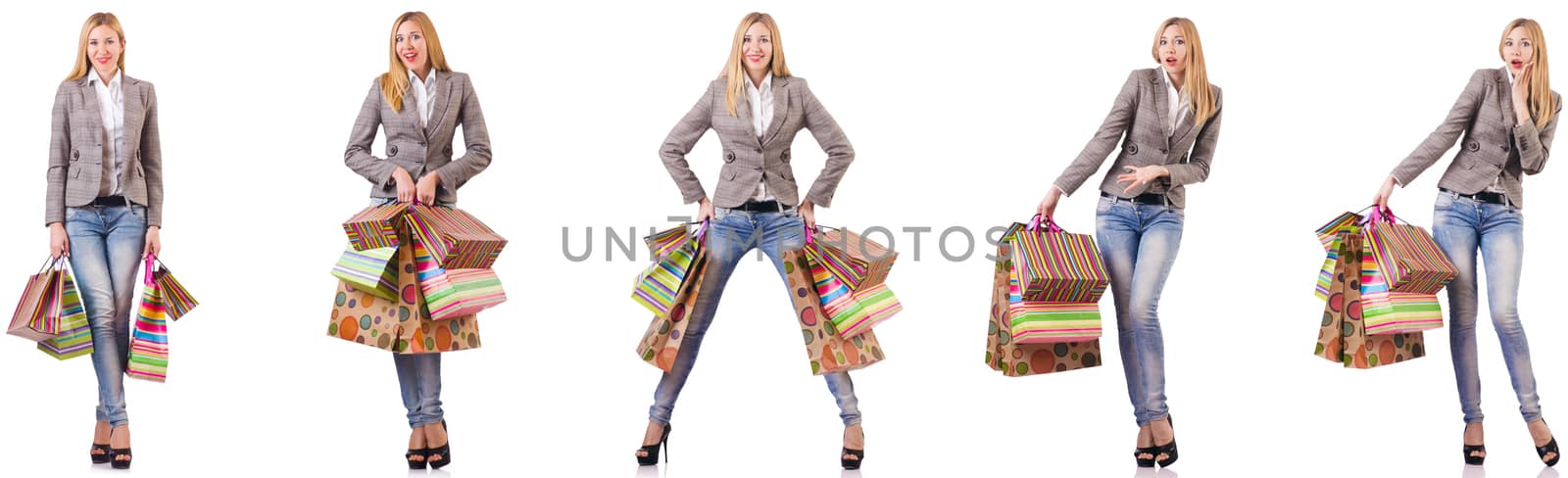 Beautiful woman with shopping bags isolated on white by Elnur