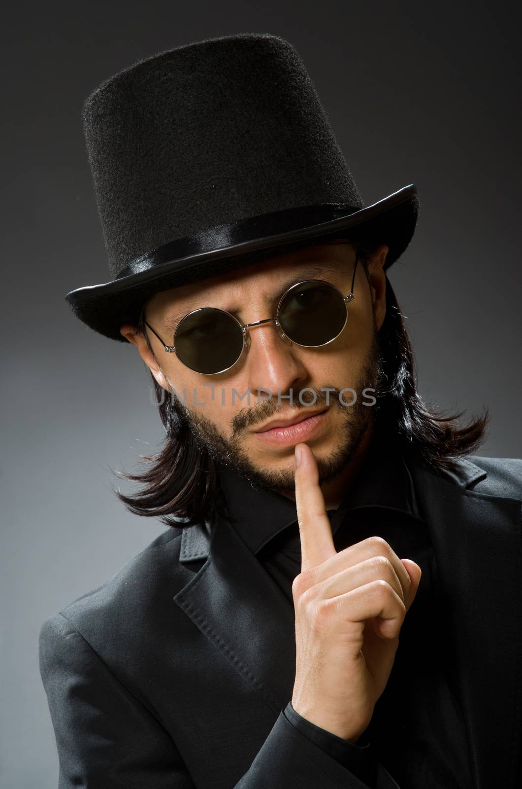 Vintage concept with man wearing black top hat