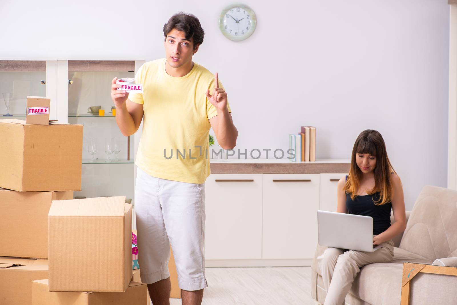 Young pair moving to new flat with fragile things 