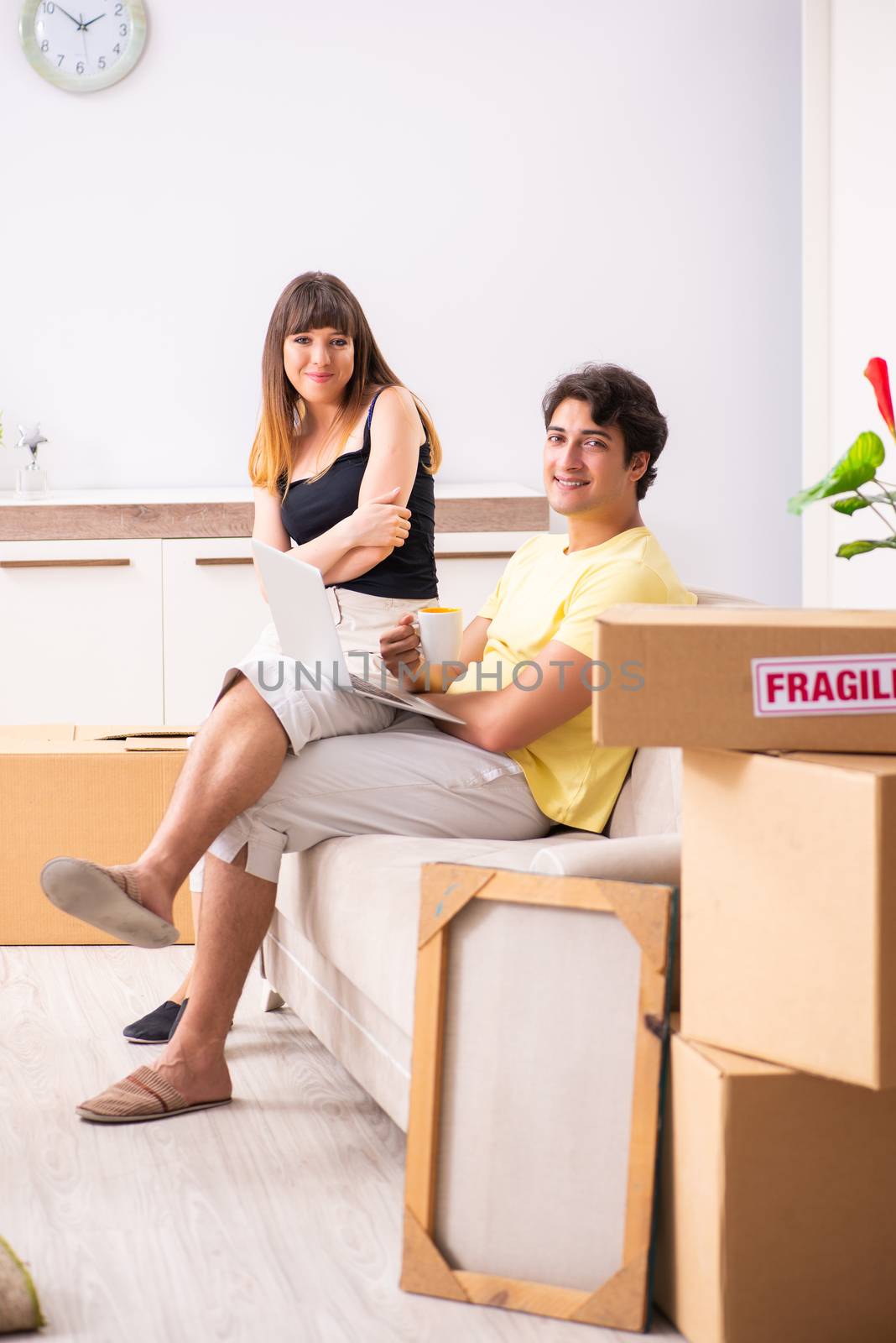 Young pair moving to new flat with fragile things  by Elnur