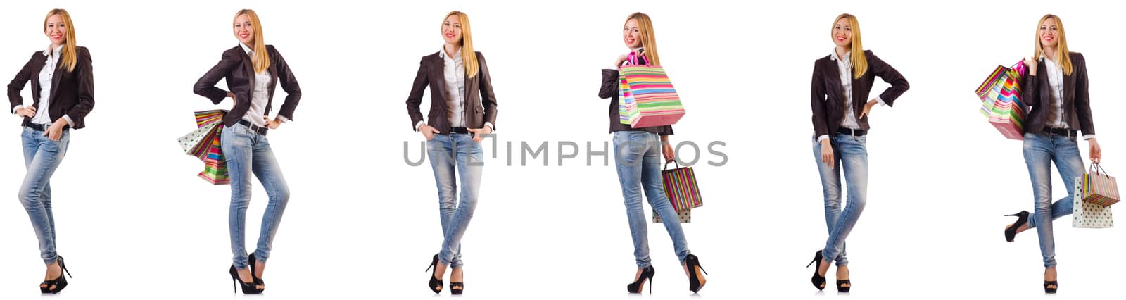 Beautiful woman with shopping bags isolated on white by Elnur