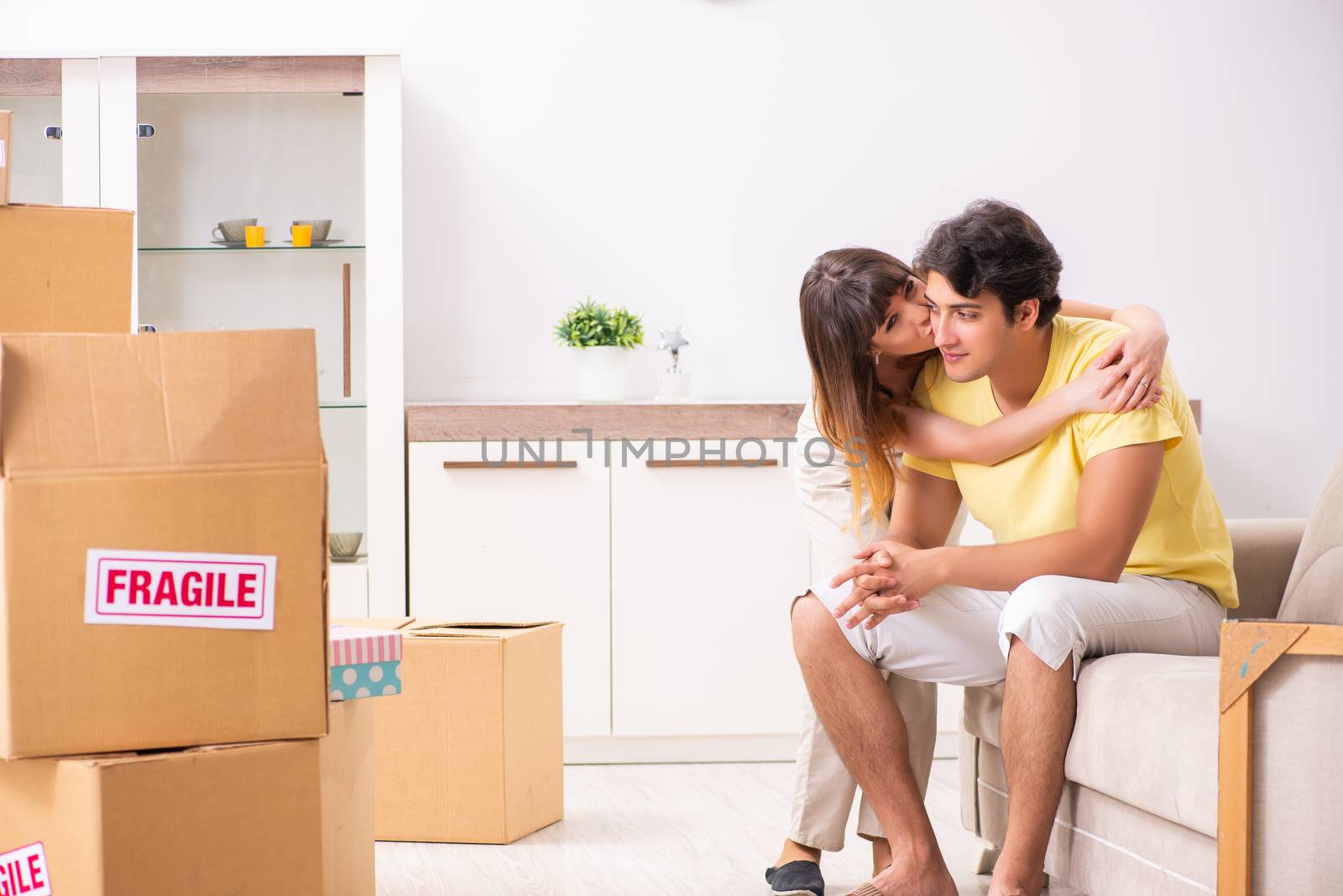 Young pair moving to new flat with fragile things 