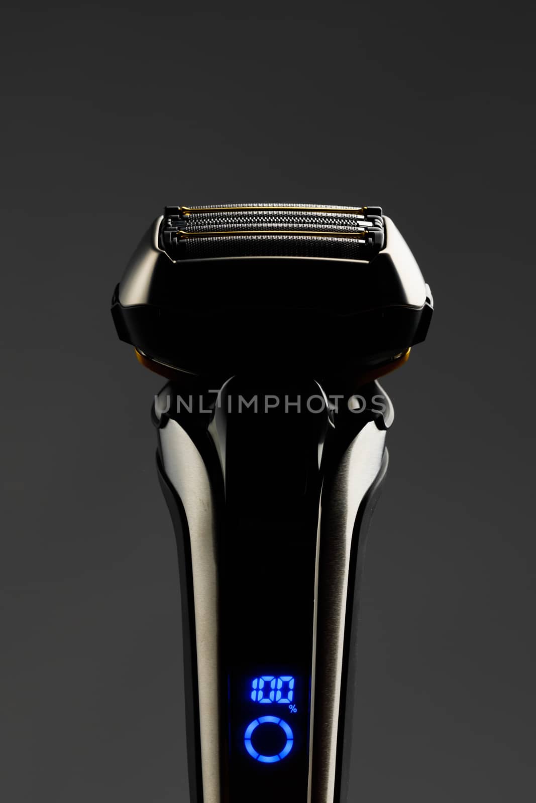 electric razor foil shaver mesh and blades, close-up view, gray background