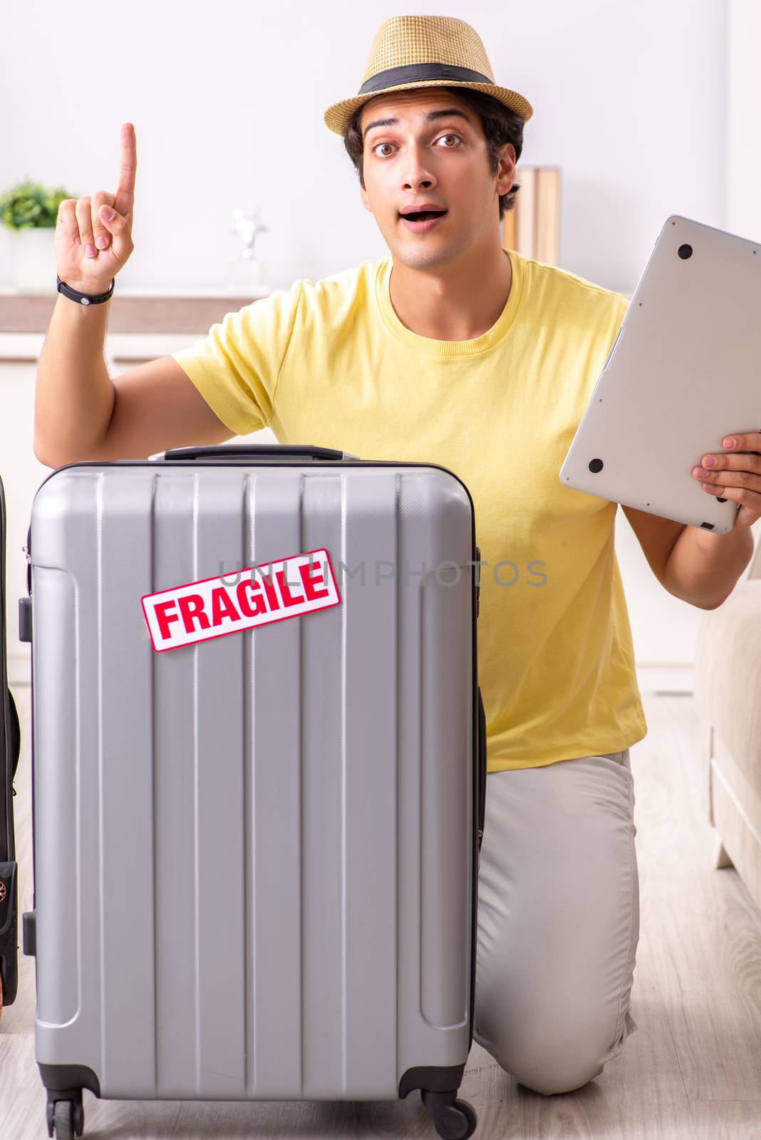 Man going on vacation with fragile suitcases