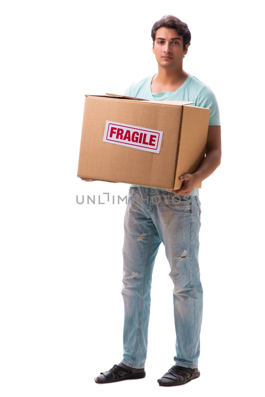 Young handsome man with fragile box ordered from Internet 