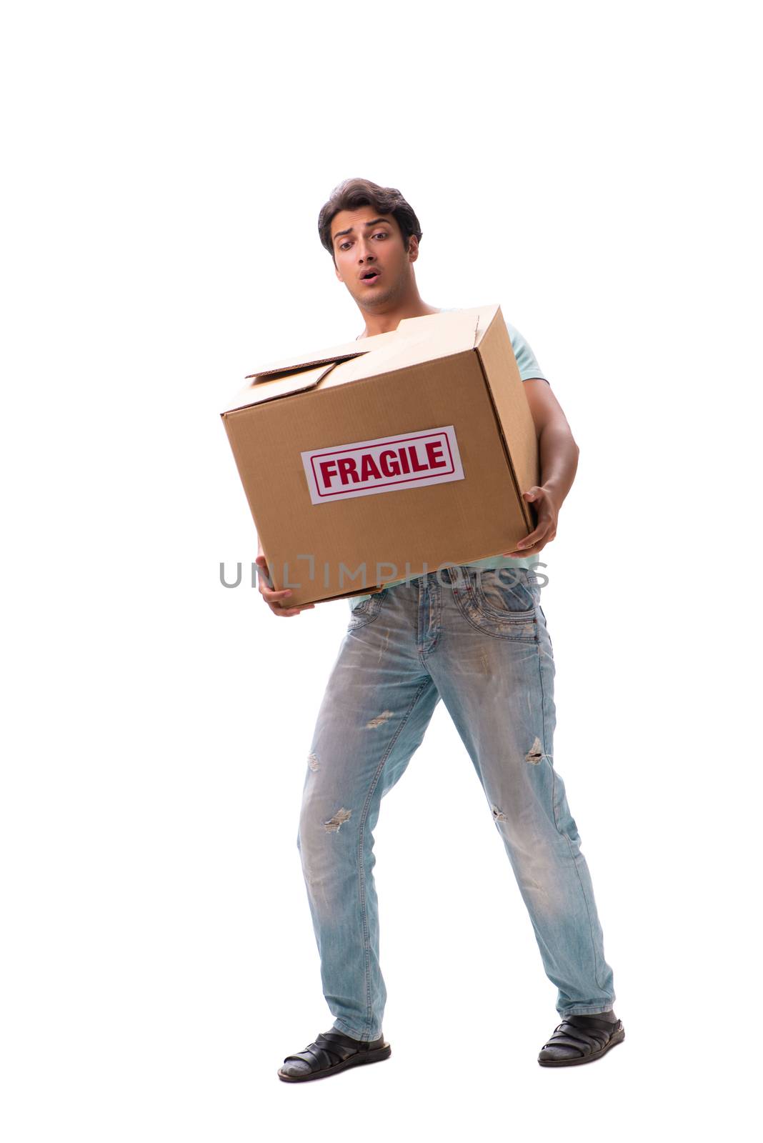 Young handsome man with fragile box ordered from Internet 