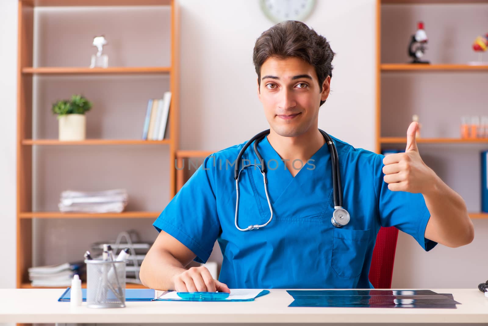Young handsome doctor radiologyst working in clinic 
