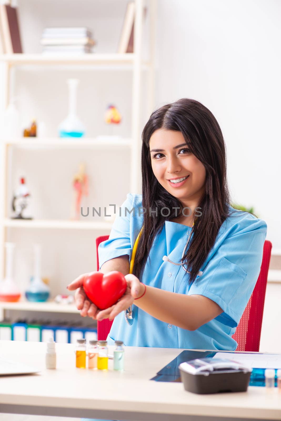 Young beautiful female doctor working in the clinic 