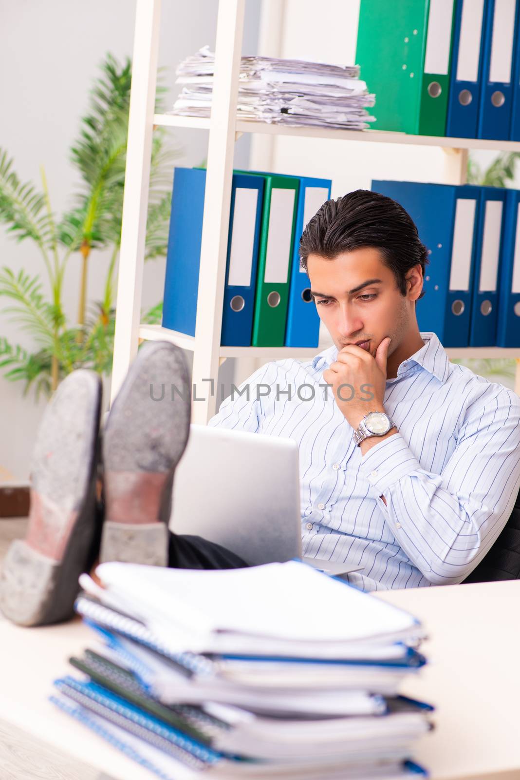 Young employee sitting at the office 