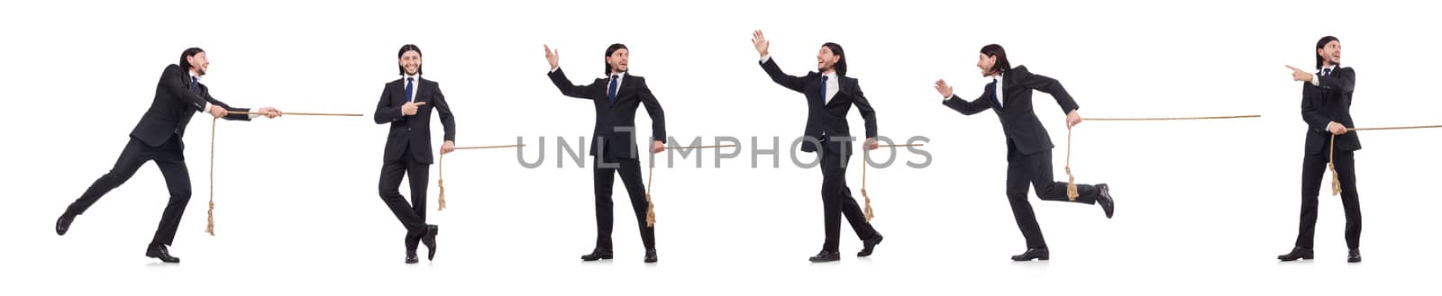 Young businessman pulling rope isolated on white