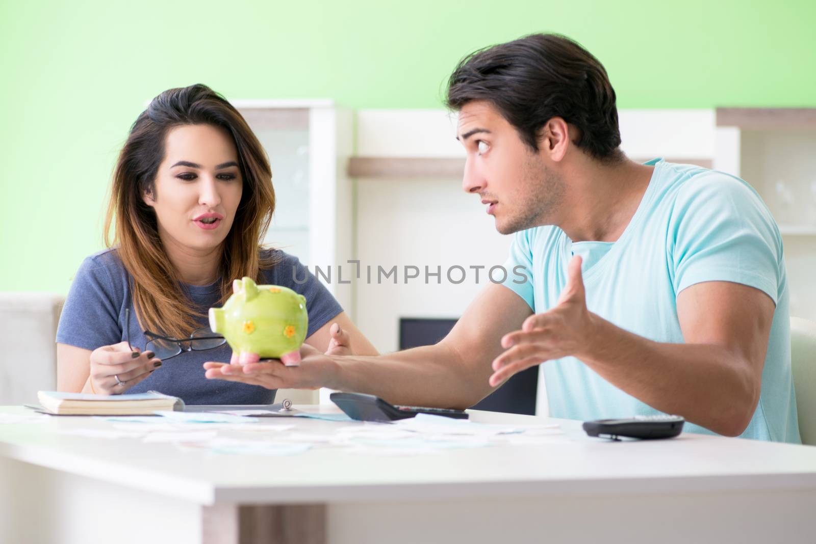 Young family struggling with personal finance by Elnur