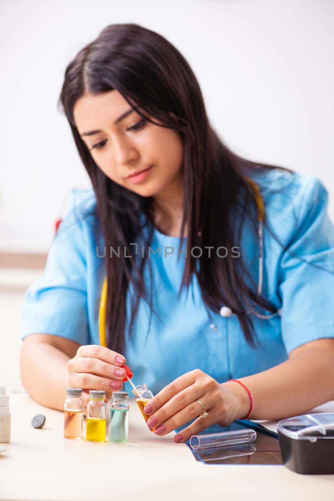 Young beautiful female doctor working in the clinic 